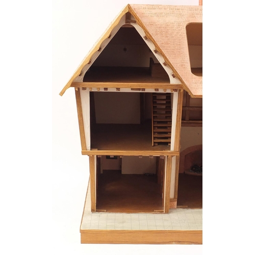 723 - Large Tudor design doll's house, 79cm H x 92cm W x 53.5cm D