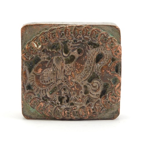 234 - Chinese patinated bronze dragon and phoenix design seal with character marks, 4.5cm x 4.5cm