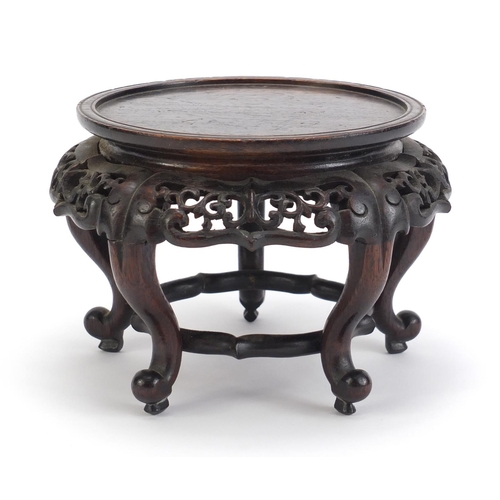 839 - Chinese hardwood stand carved with foliage, 13.5cm high x 19cm in diameter