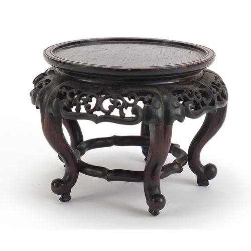 839 - Chinese hardwood stand carved with foliage, 13.5cm high x 19cm in diameter