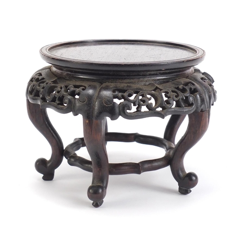 839 - Chinese hardwood stand carved with foliage, 13.5cm high x 19cm in diameter