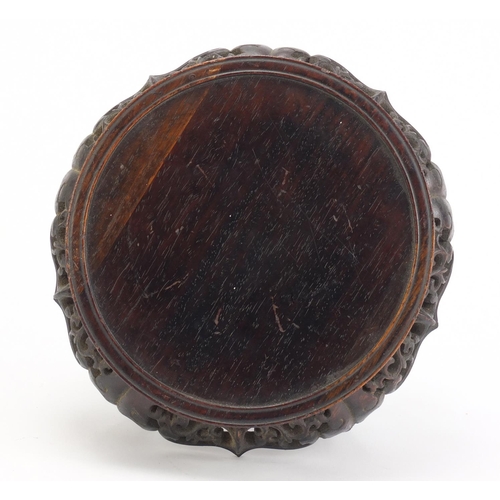 839 - Chinese hardwood stand carved with foliage, 13.5cm high x 19cm in diameter