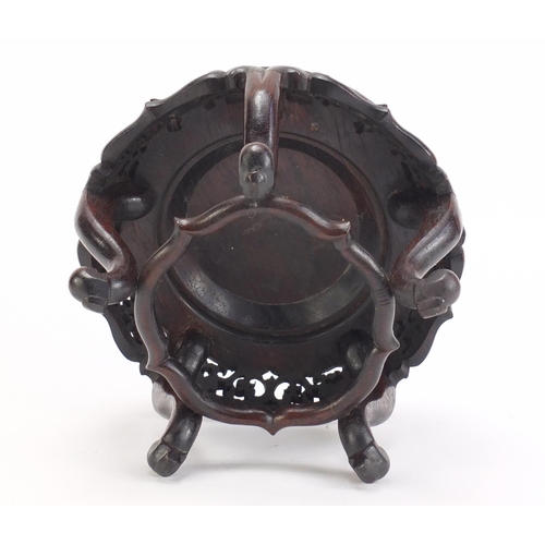 839 - Chinese hardwood stand carved with foliage, 13.5cm high x 19cm in diameter