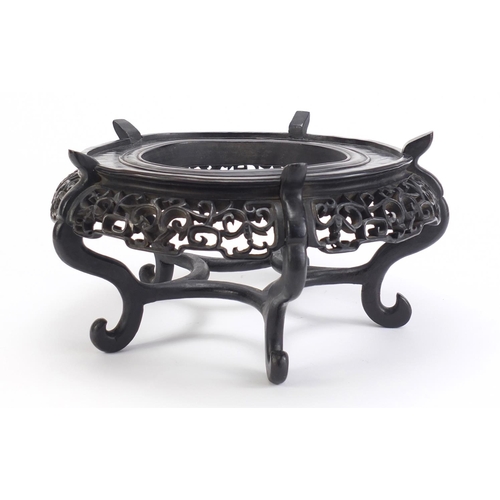 641 - Good Chinese hardwood stand carved with bats and foliage, 16cm high x 30.5cm in diameter