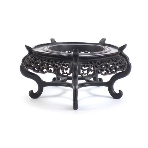 641 - Good Chinese hardwood stand carved with bats and foliage, 16cm high x 30.5cm in diameter