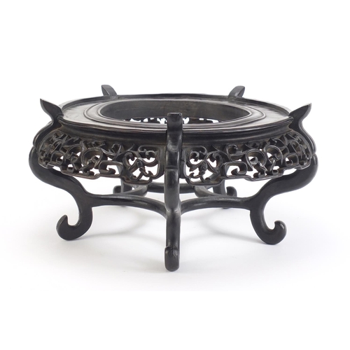 641 - Good Chinese hardwood stand carved with bats and foliage, 16cm high x 30.5cm in diameter