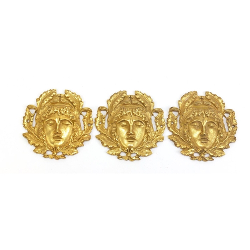 1127 - Three 19th century Ormolu furniture mounts, each 9cm in diameter