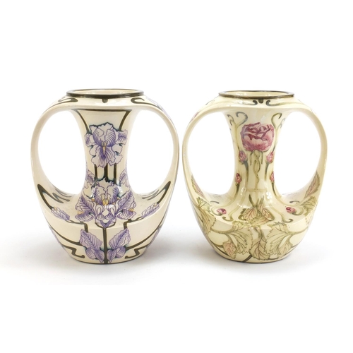 787 - Two Art Nouveau style Cobridge vases with twin handles hand painted with flowers, one limited editio... 