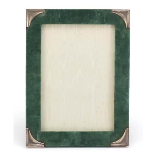 815 - Rectangular velvet easel photo frame with silver mounts, T.P London 1983, 30.5cm x 23cm