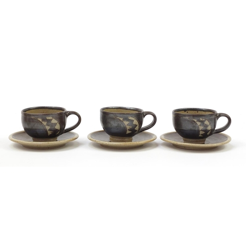 22 - Chris Lewis set of six South Heighton studio pottery cups with sauces, each hand painted with an abs... 
