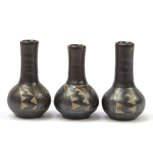 159 - Chris Lewis three South Heighton studio pottery vases hand painted with an abstract geometric design... 