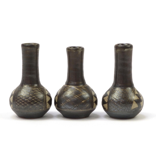 159 - Chris Lewis three South Heighton studio pottery vases hand painted with an abstract geometric design... 