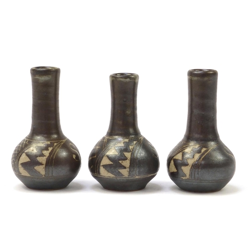 159 - Chris Lewis three South Heighton studio pottery vases hand painted with an abstract geometric design... 