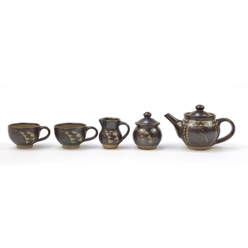 854 - Chris Lewis South Heighton studio pottery tea for two including a teapot, each hand painted with an ... 