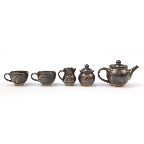 854 - Chris Lewis South Heighton studio pottery tea for two including a teapot, each hand painted with an ... 