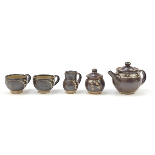 853 - Chris Lewis South Heighton studio pottery tea for two including a teapot, each hand painted with an ... 