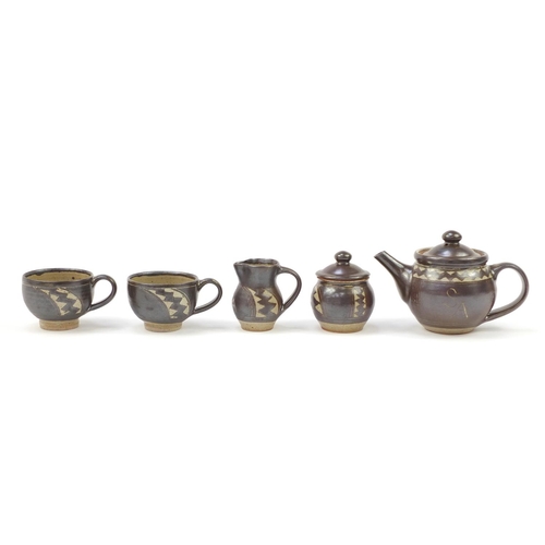 853 - Chris Lewis South Heighton studio pottery tea for two including a teapot, each hand painted with an ... 