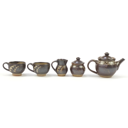 853 - Chris Lewis South Heighton studio pottery tea for two including a teapot, each hand painted with an ... 