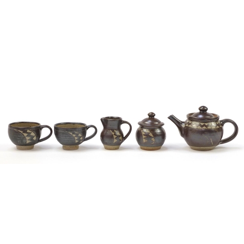 189 - Chris Lewis South Heighton studio pottery tea for two including a teapot, each hand painted with an ... 