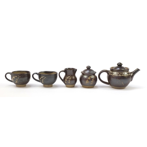 189 - Chris Lewis South Heighton studio pottery tea for two including a teapot, each hand painted with an ... 