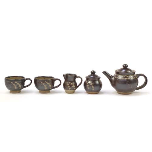 783 - Chris Lewis South Heighton studio pottery tea for two including a teapot, each hand painted with an ... 