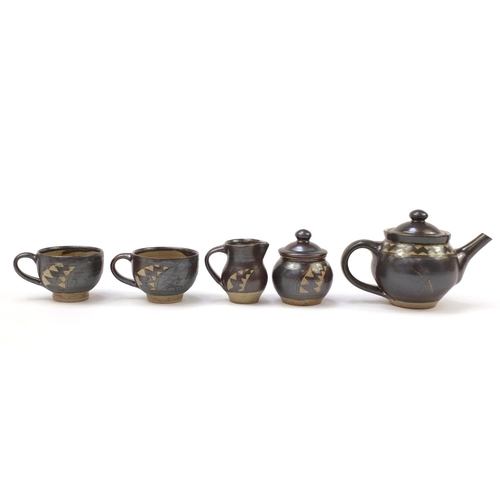 783 - Chris Lewis South Heighton studio pottery tea for two including a teapot, each hand painted with an ... 