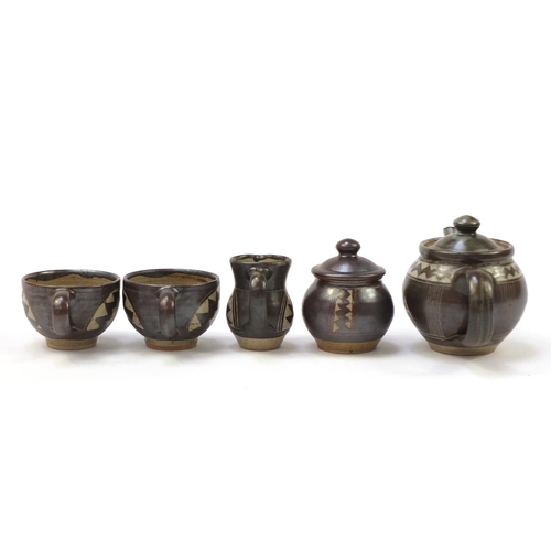 21 - Chris Lewis South Heighton studio pottery tea for two including a teapot, each hand painted with an ... 