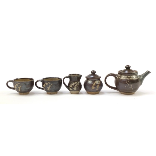 21 - Chris Lewis South Heighton studio pottery tea for two including a teapot, each hand painted with an ... 