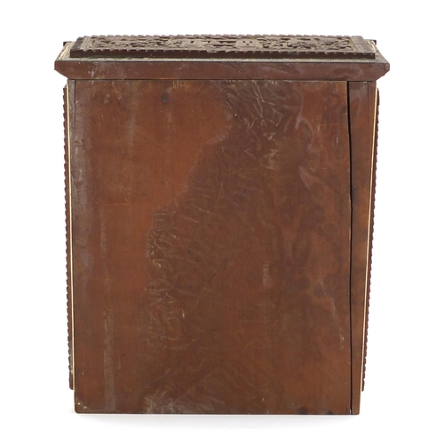 528 - Indian Vizagapatam upright travelling chest, the front panels carved with animals and flowers, 26cm ... 