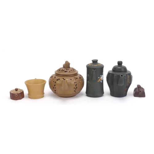 490 - Chinese Yixing teracotta comprising three teapots, two miniature teapots and a cup, the five teapots... 