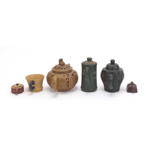 490 - Chinese Yixing teracotta comprising three teapots, two miniature teapots and a cup, the five teapots... 