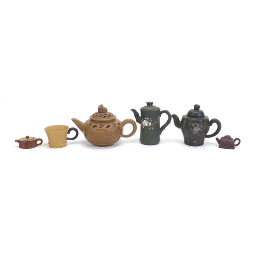 490 - Chinese Yixing teracotta comprising three teapots, two miniature teapots and a cup, the five teapots... 