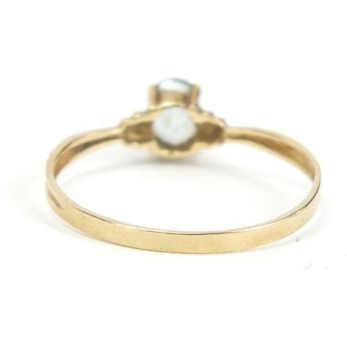 536 - 9ct gold blue stone solitaire ring, size O, 1.0g