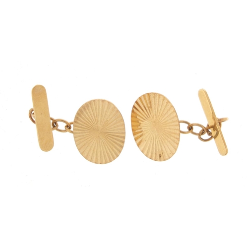 1062 - Pair of 9ct gold cufflinks with engine turned decoration, 2.0g