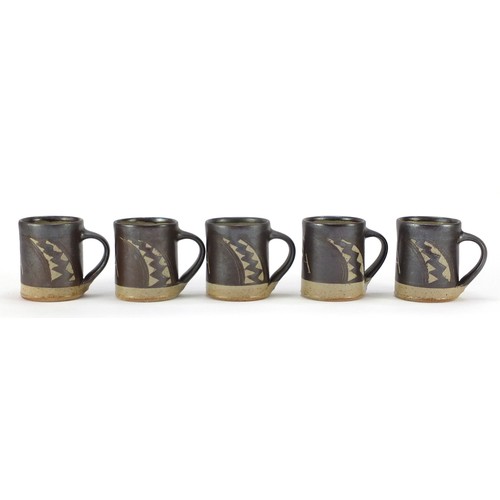 190 - Chris Lewis South Heighton studio pottery ten mugs hand painted with an abstract geometric design, e... 