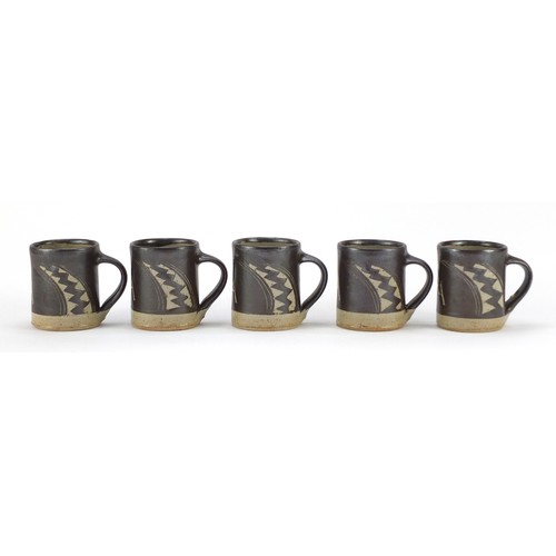 190 - Chris Lewis South Heighton studio pottery ten mugs hand painted with an abstract geometric design, e... 
