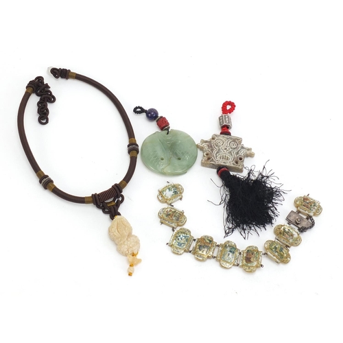 1161 - Asian objects including a carved jade fish pendant and mother of pearl bracelet decorated with templ... 