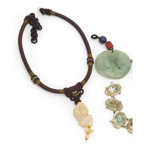 1161 - Asian objects including a carved jade fish pendant and mother of pearl bracelet decorated with templ... 