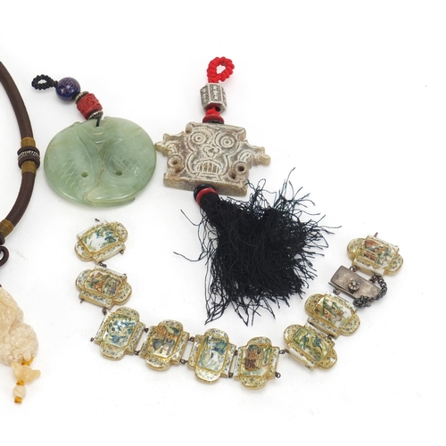 1161 - Asian objects including a carved jade fish pendant and mother of pearl bracelet decorated with templ... 