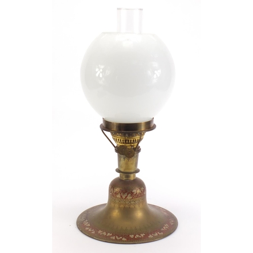 977 - Indian brass oil lamp engraved with flowers, 43.5cm high