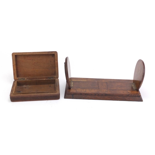 693 - Oak shoe horse design extending book slide and a carved hardwood box, the largest 33cm wide