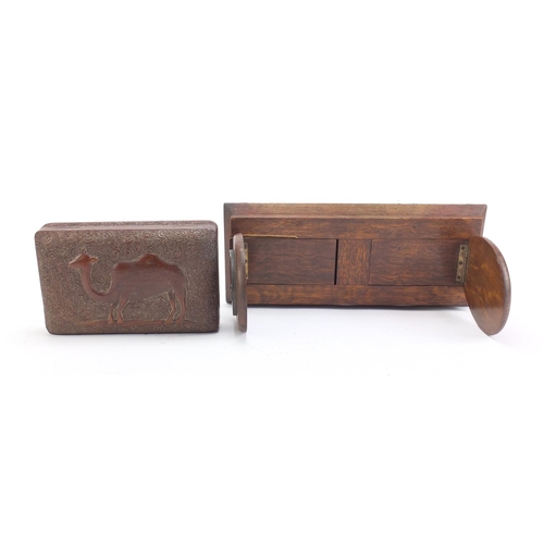 693 - Oak shoe horse design extending book slide and a carved hardwood box, the largest 33cm wide