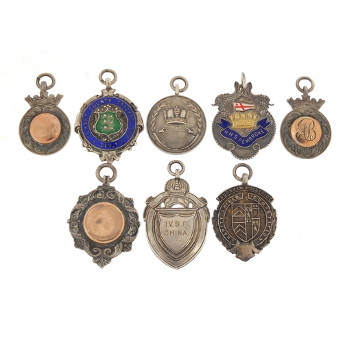 821 - Eight naval interest silver sporting jewels, two with enamel including HMS Pembroke, HMS Medway, HMS... 