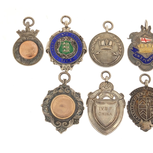 821 - Eight naval interest silver sporting jewels, two with enamel including HMS Pembroke, HMS Medway, HMS... 