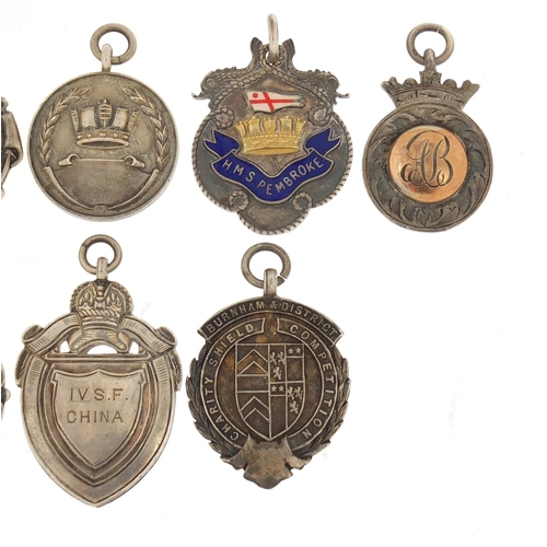 821 - Eight naval interest silver sporting jewels, two with enamel including HMS Pembroke, HMS Medway, HMS... 