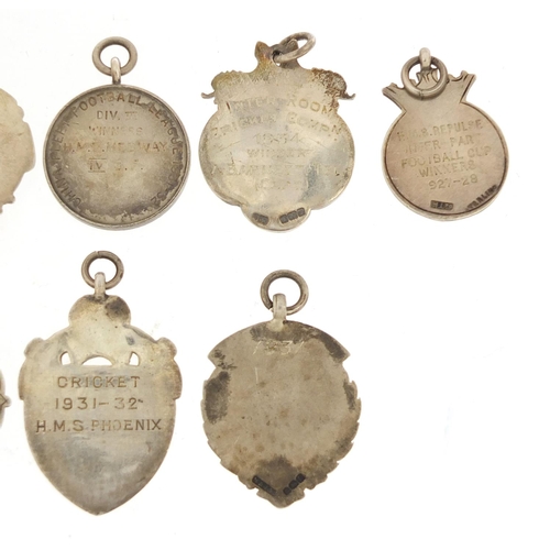 821 - Eight naval interest silver sporting jewels, two with enamel including HMS Pembroke, HMS Medway, HMS... 