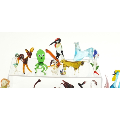 1074 - Collection of colourful glass animals including a bird and swan with square marble bases, the larges... 