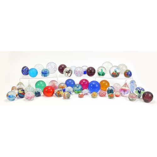 1556 - Collection of colourful glass paperweights, the largest 13.5cm high