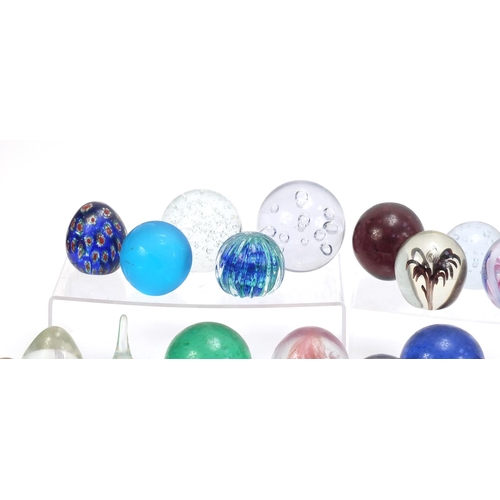 1556 - Collection of colourful glass paperweights, the largest 13.5cm high