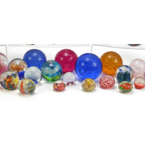 1556 - Collection of colourful glass paperweights, the largest 13.5cm high